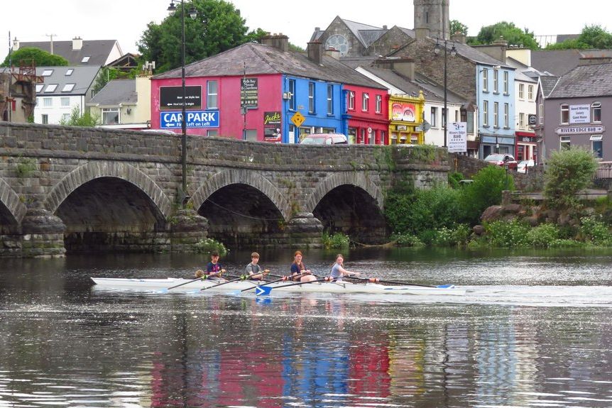 The stone bridge over the River Laune at Killorglin, with colourful houses beyond