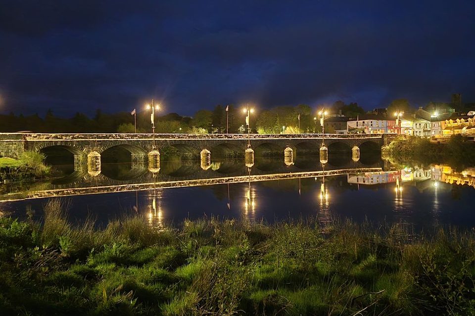 The stone bridge over the River Laune at Killorglin, lit up at night