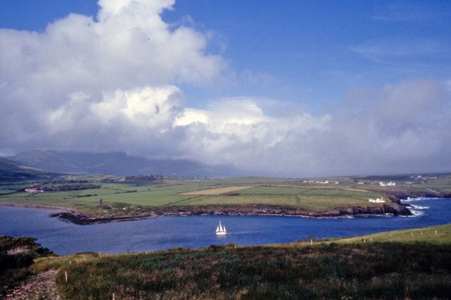 Dingle Harbour, with a sailing boat on the water