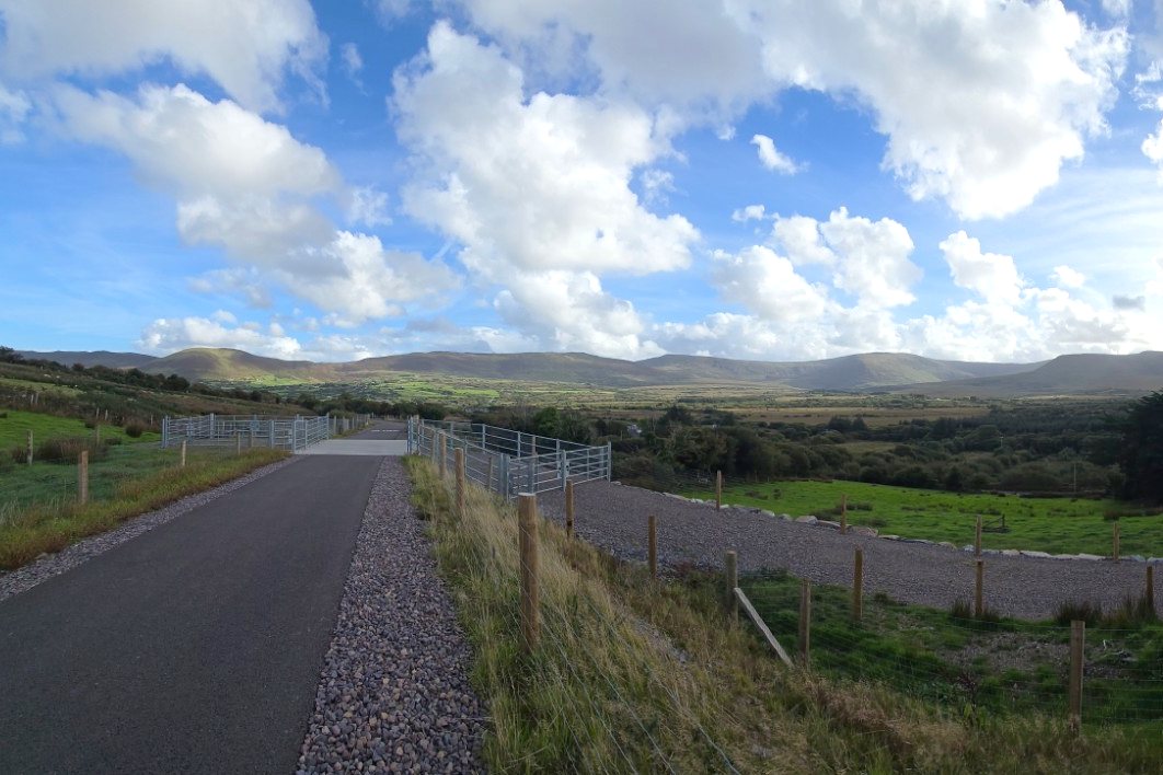 The new Greenway path near Glenbeigh, with fields and mountains under a big sky