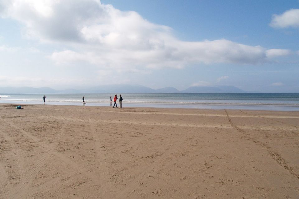 Walkers on the wide sands of Inch Strand