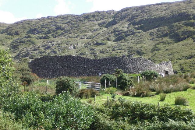 The round stone walls of Staigue Fort below the hills