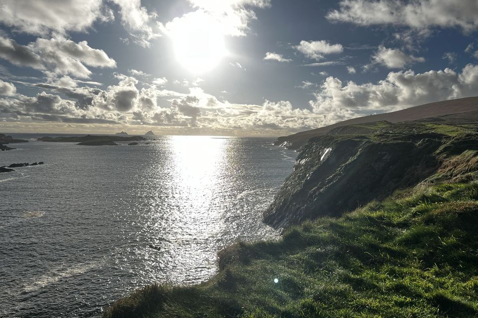 Cliffs on Valentia Island with the sun over the sea