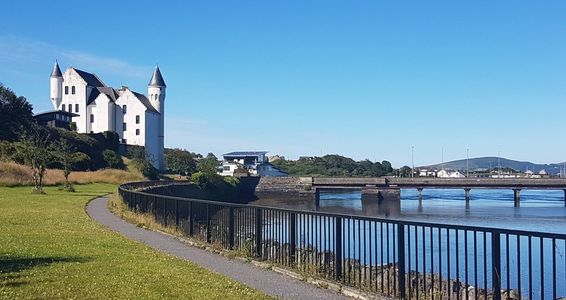 The Old Barracks in Cahersiveen, a white building with towers and turrets