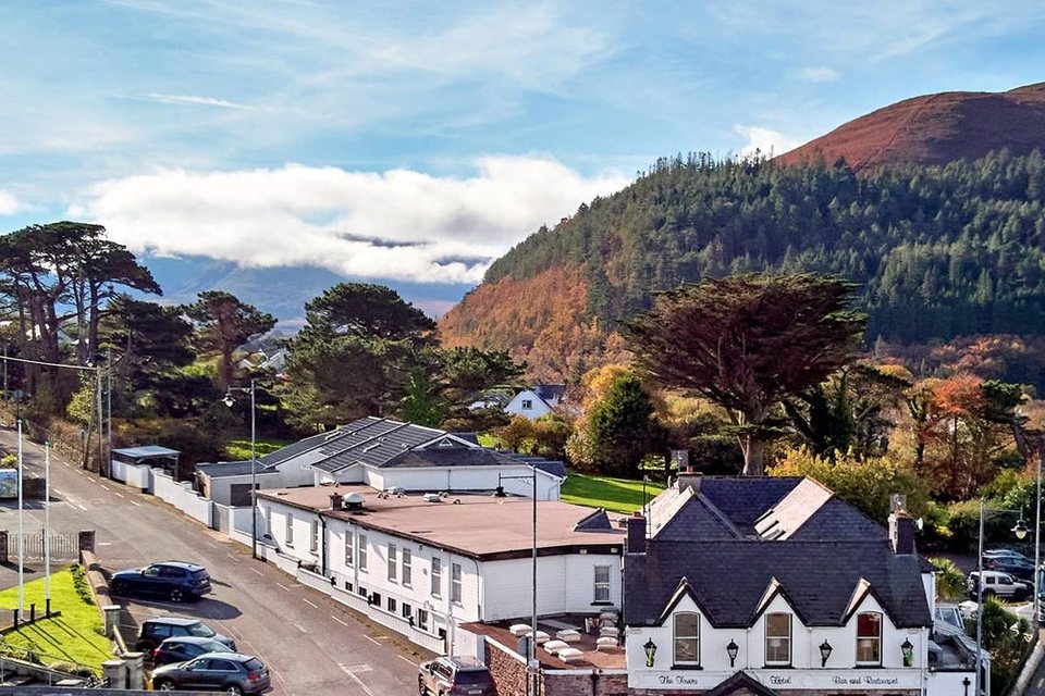 Glenbeigh village from the air, with its church and the hills behind