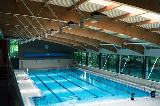 The main pool under a curved timber roof at Killarney Sports & Leisure Centre